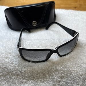 Sunglasses/Ferragamo in black with embossed sides